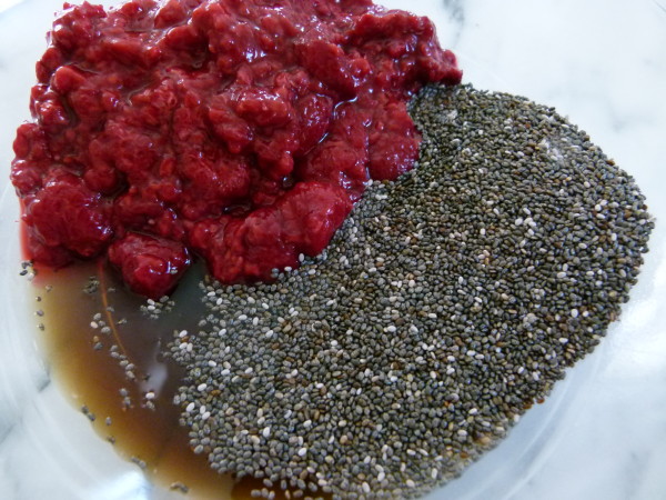 chia seeds, defrosted frozen raspberries and maple syrup