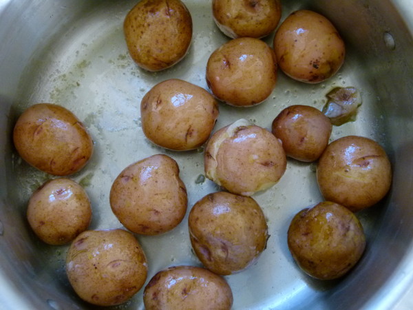 toss boiled potatoes in a little oil