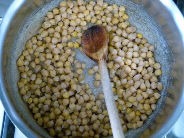 cook the soaked, drained chickpeas with a little baking soda before boiling