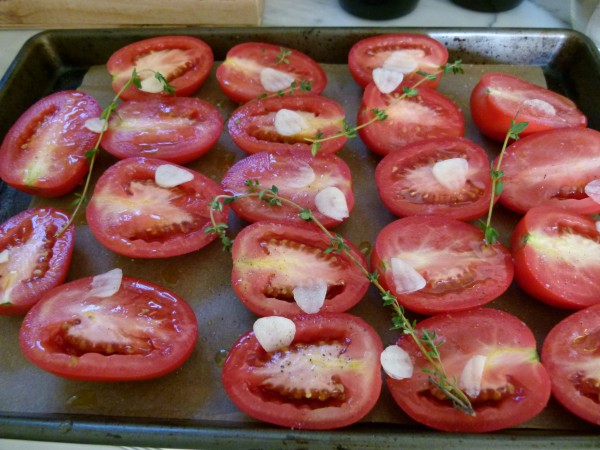 raw tomatoes prepped for roasting