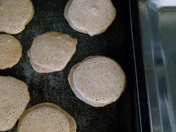 cook them until dry on the sides and bubbles on top