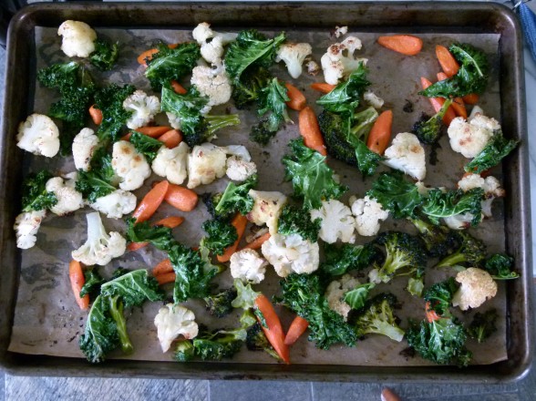 roasting veggies on a parchment-lined baking sheet