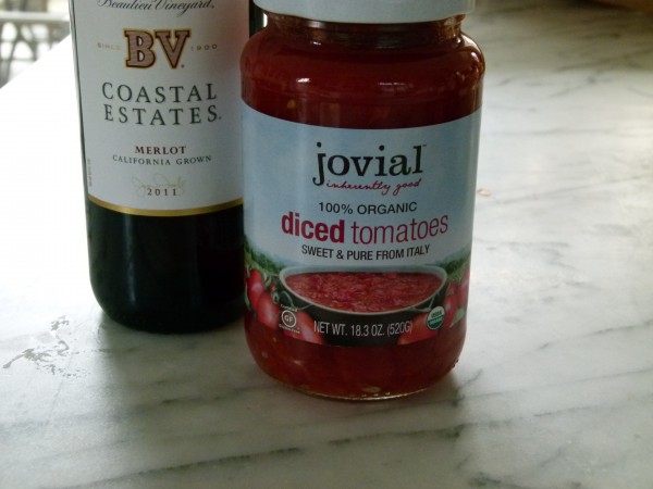 dry red wine and organic diced tomatoes in a glass jar