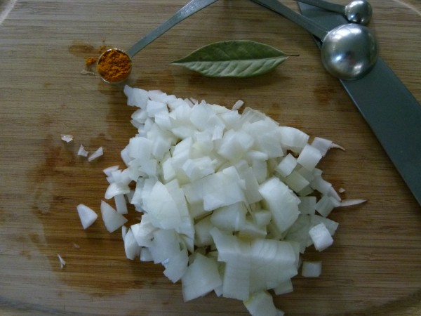 chopped onion, bay leaf and turmeric