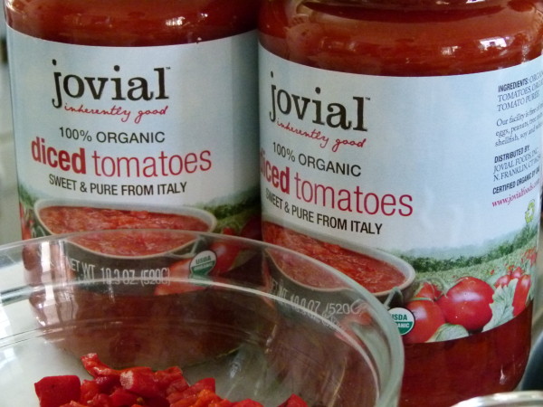 Jovial tomatoes in glass jars