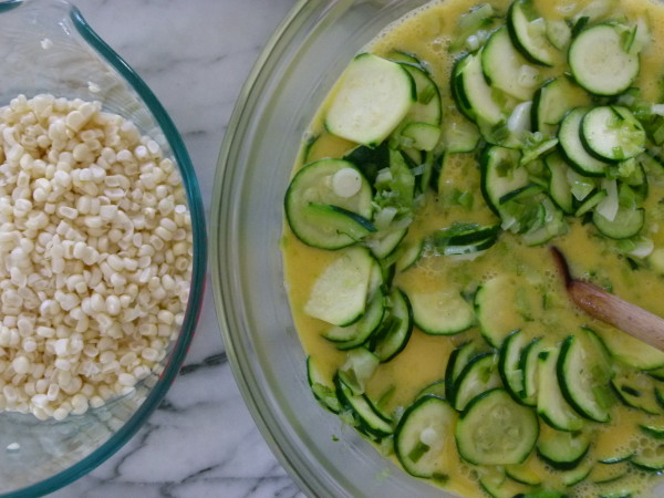 mix sautéed zucchini with eggs and then add corn