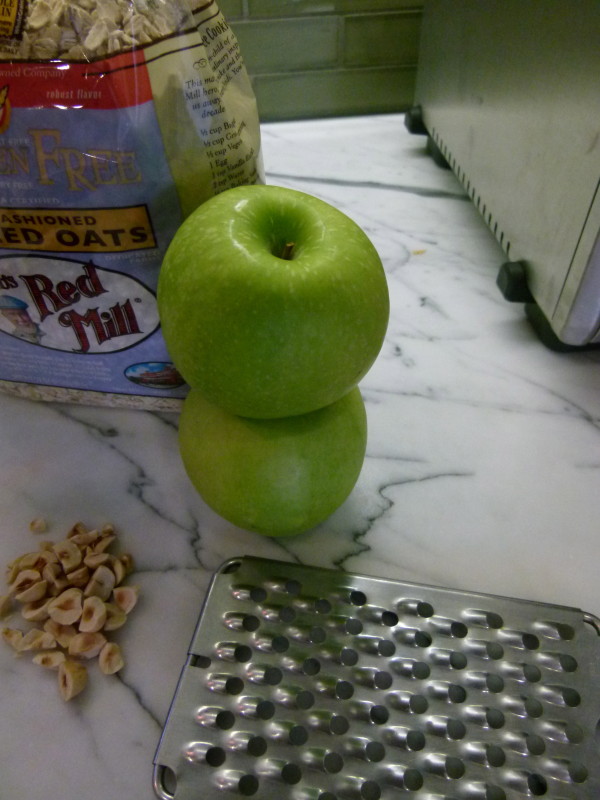 grate 2 green apples, skin and all