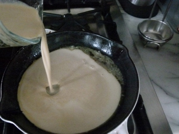 pour batter into the hot pan