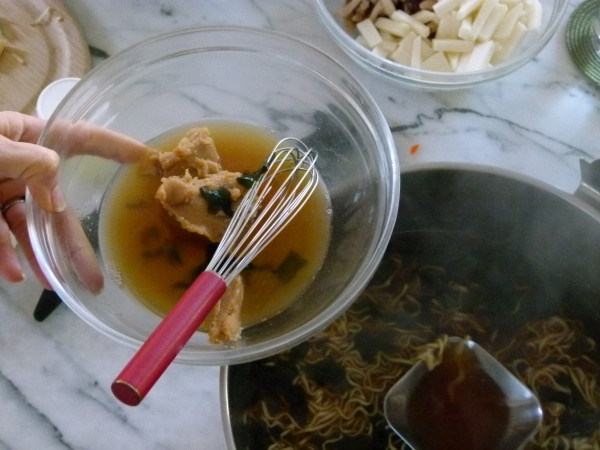 dissolve the miso separately and add to the finished soup