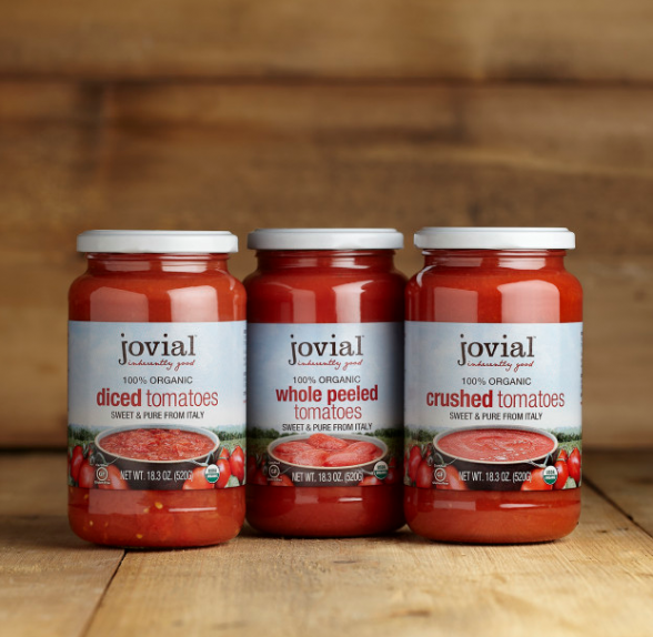 Jovial organic tomatoes in glass jars