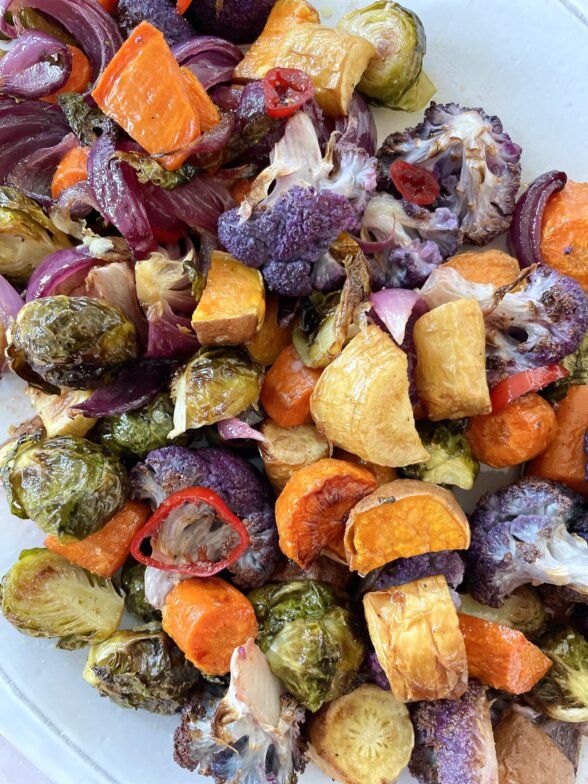 a close up shot of roasted fall vegetables recipe with agrodolce on top