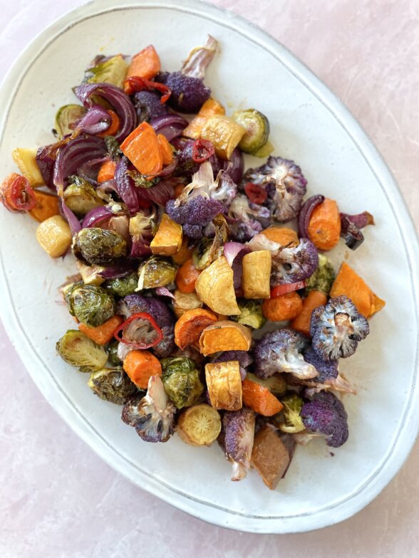 a serving platter with roasted veggies on top