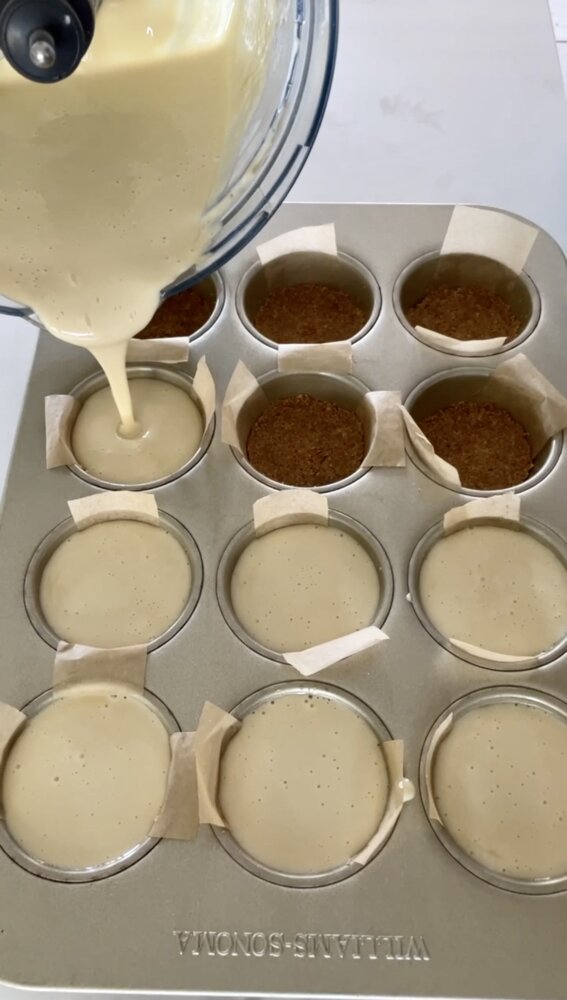 filling muffin wells with cheesecake filling