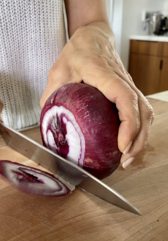 slicing a red onion
