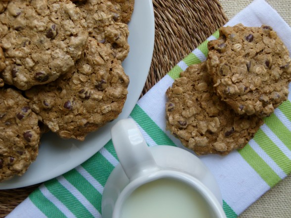 vegan oatmeal chocolate chip cookies on a plate with milk