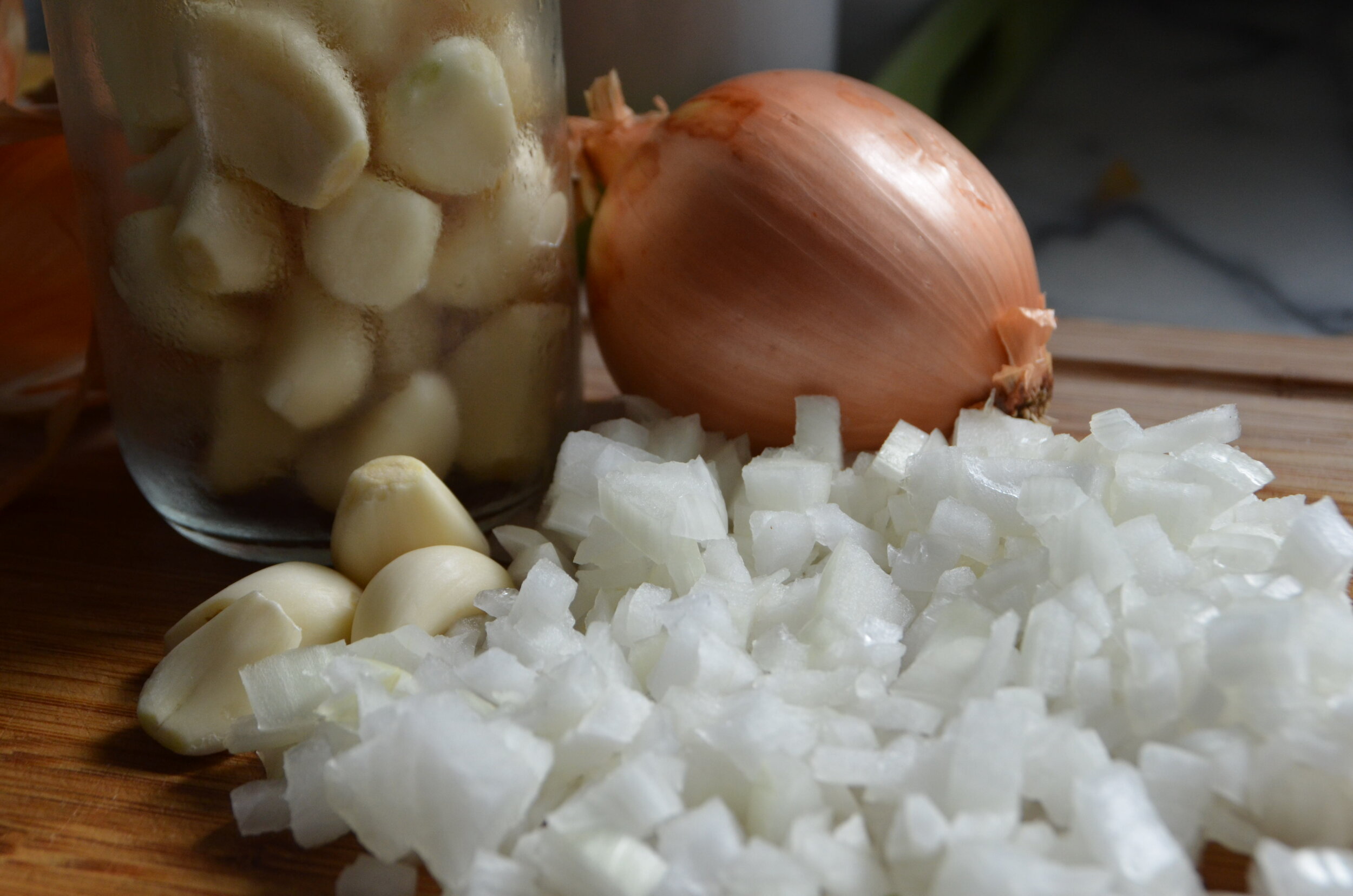 raw onions and garlic on a counter