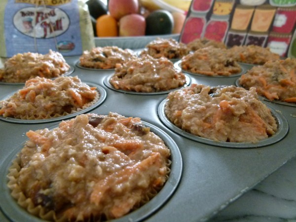 banana carrot muffin batter filled to the top of a muffin pan