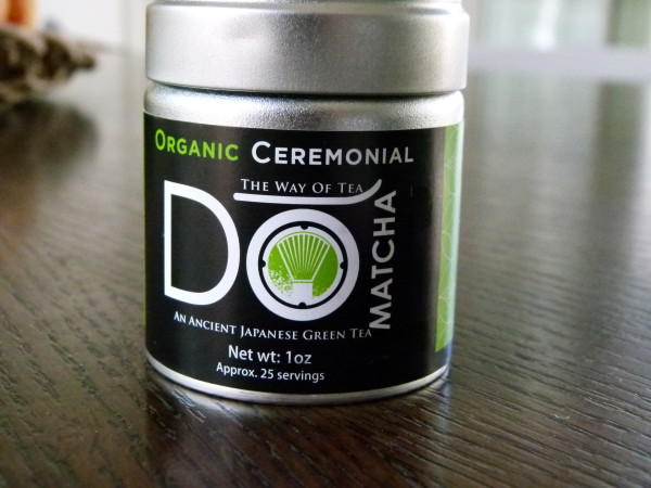 a canister filled with matcha