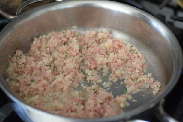 Turkey meatloaf recipe mixture being cooked on the stove in a pan.