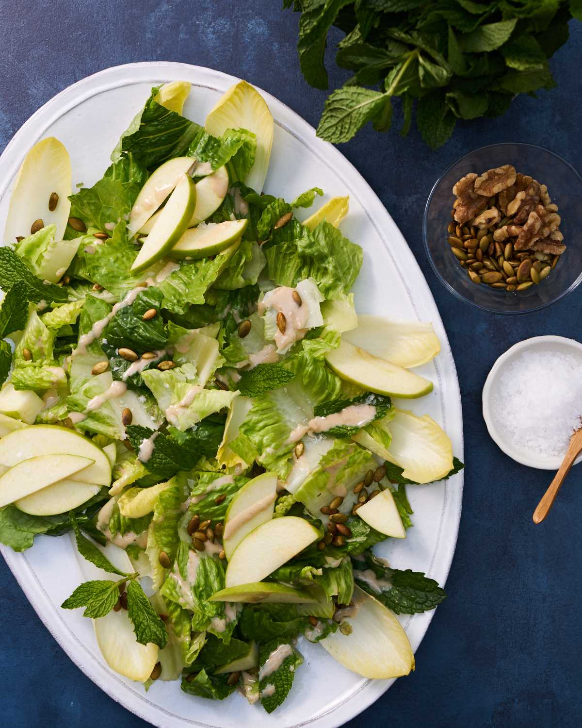 an autumn salad recipe on a white serving platter