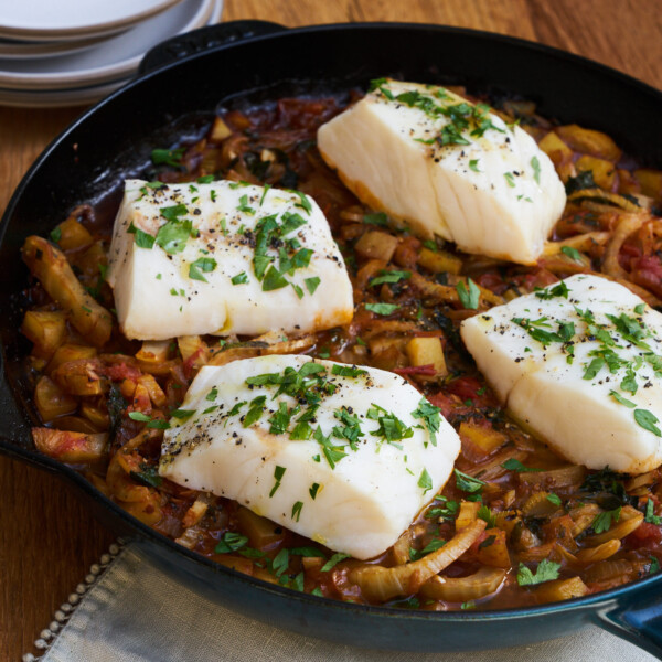 Cod Acqua Pazza in a cast iron skillet