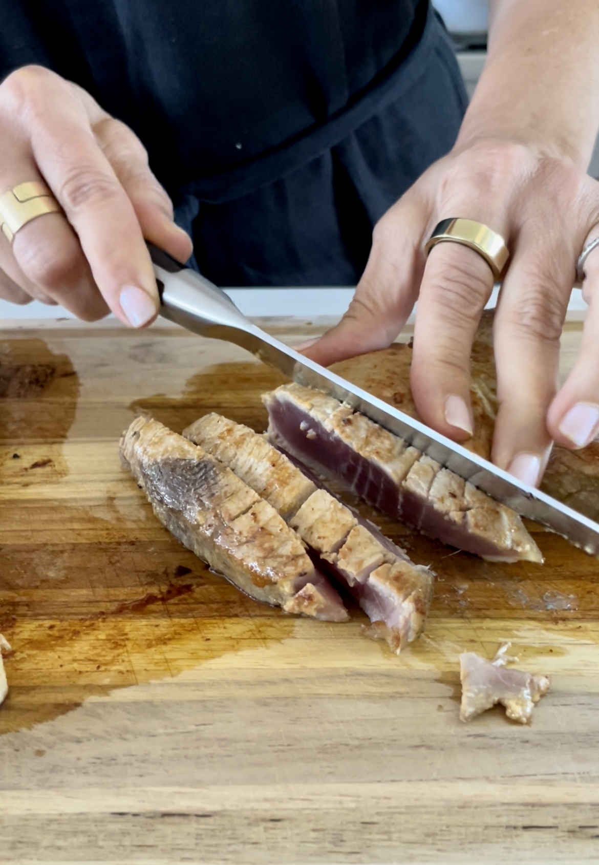 slicing cooked fish with a sharp knife