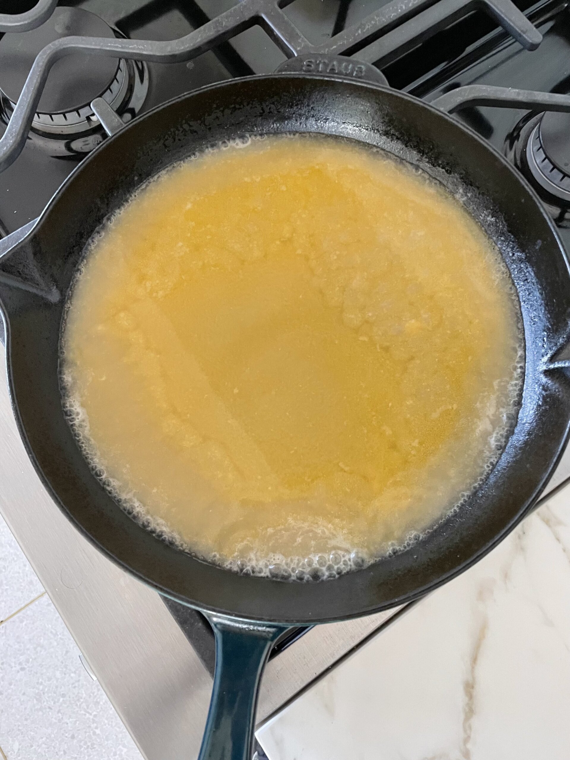 gravy in a cast iron skillet on a stove