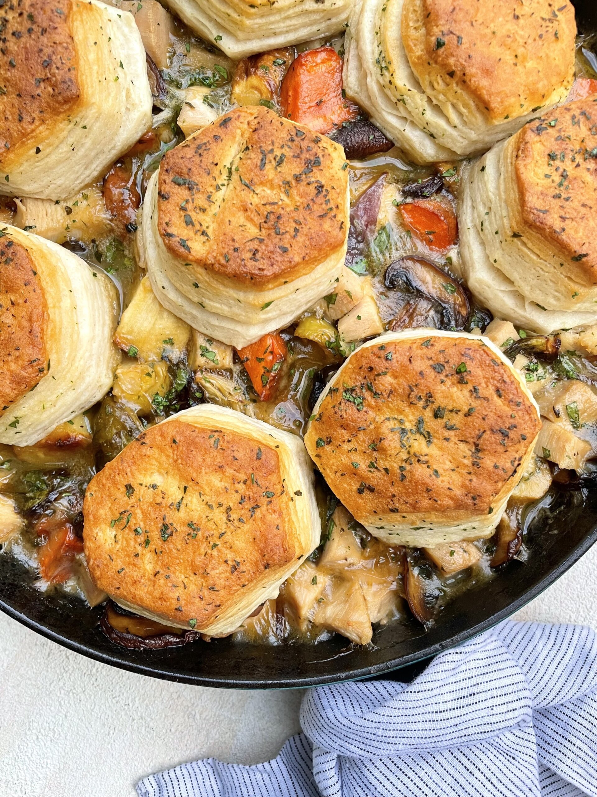 biscuits on pot pie in a skillet