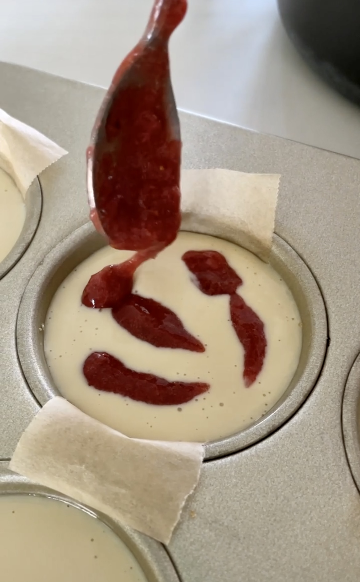 strawberry swirl on a mini cheesecake