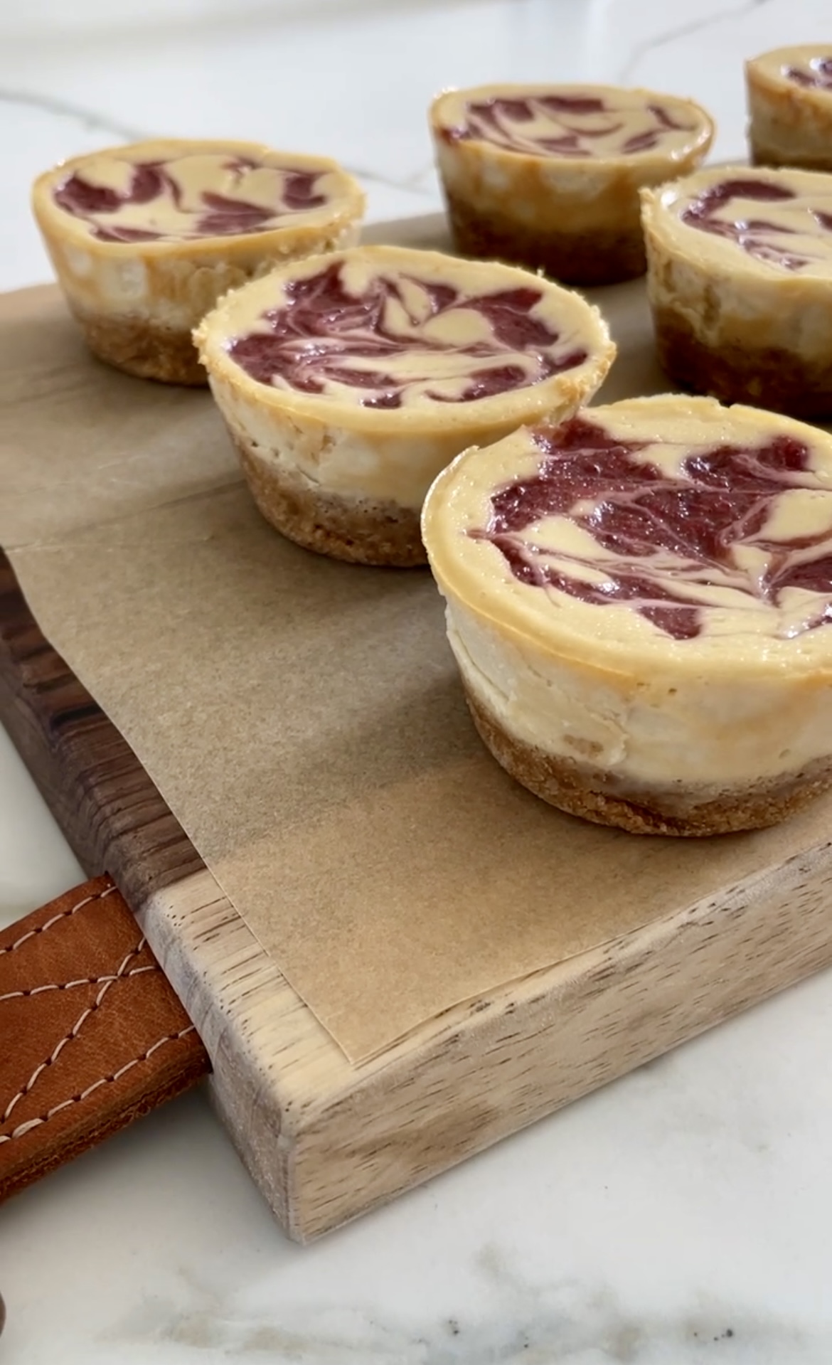 mini strawberry cheesecake recipe finished on a cutting board