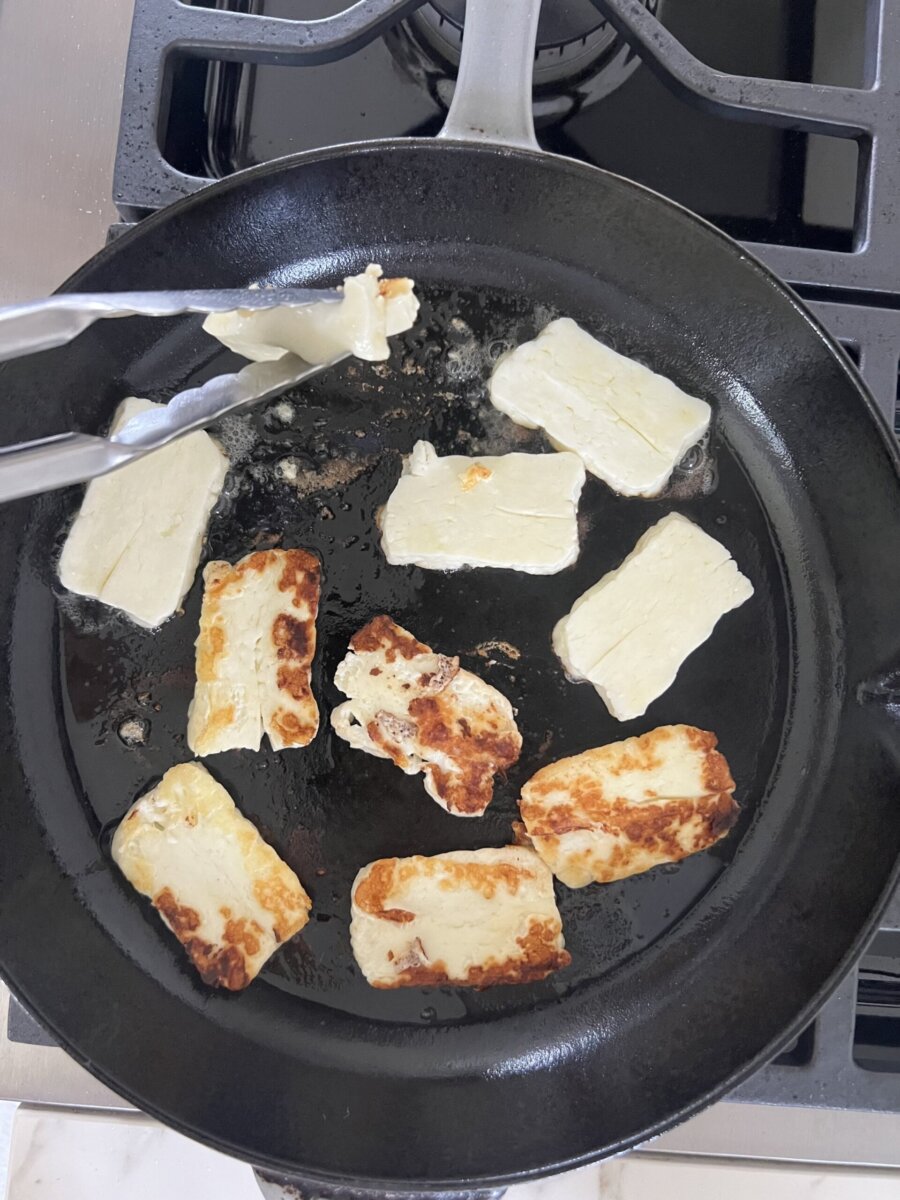 halloumi grilling in a pan