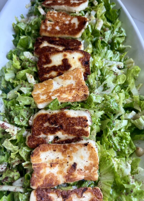 a halloumi salad in a serving platter