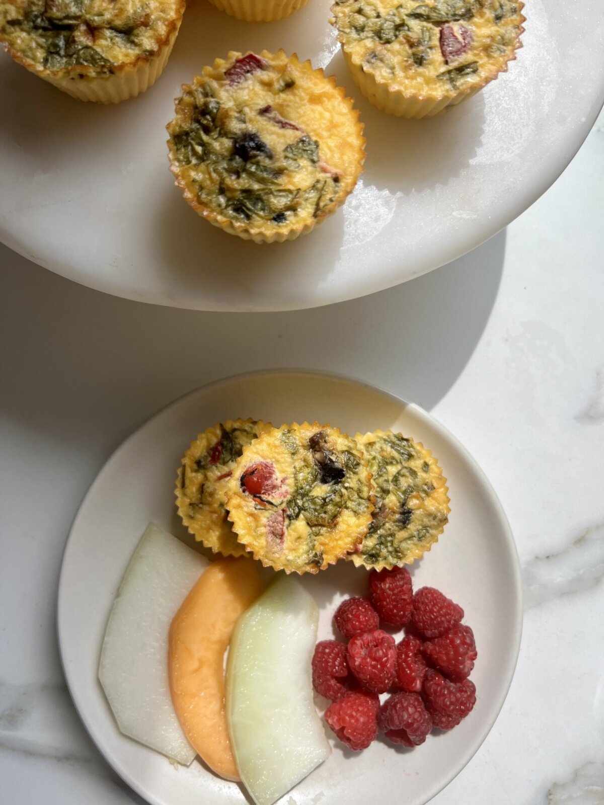 starbucks copycat egg bites served on a plate with fresh fruit