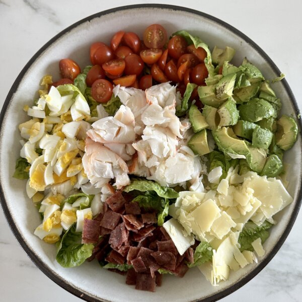 an overhead photo of lobster cobb salad in a bowl