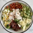 an overhead photo of lobster cobb salad in a bowl