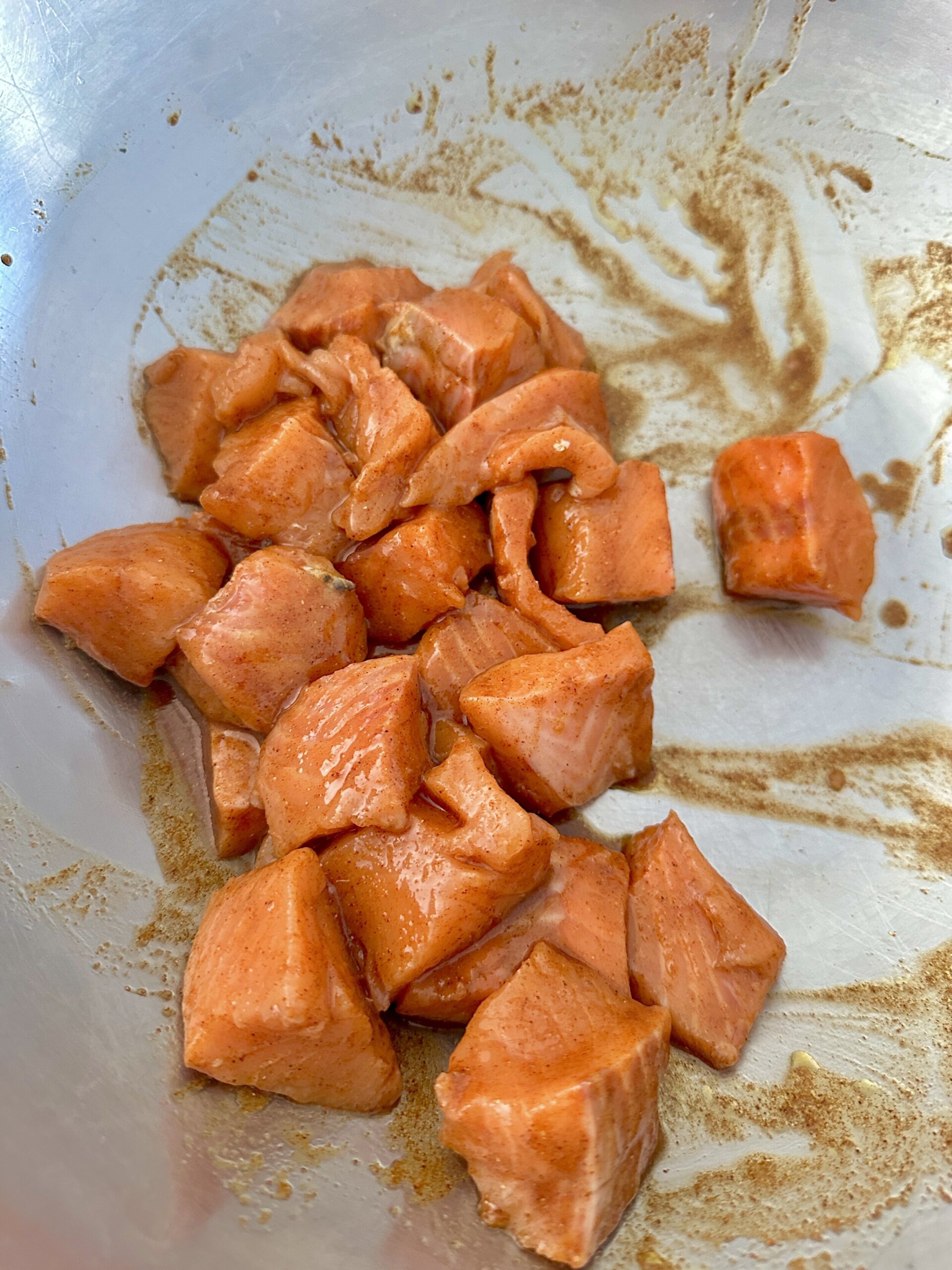 salmon marinating in a bowl