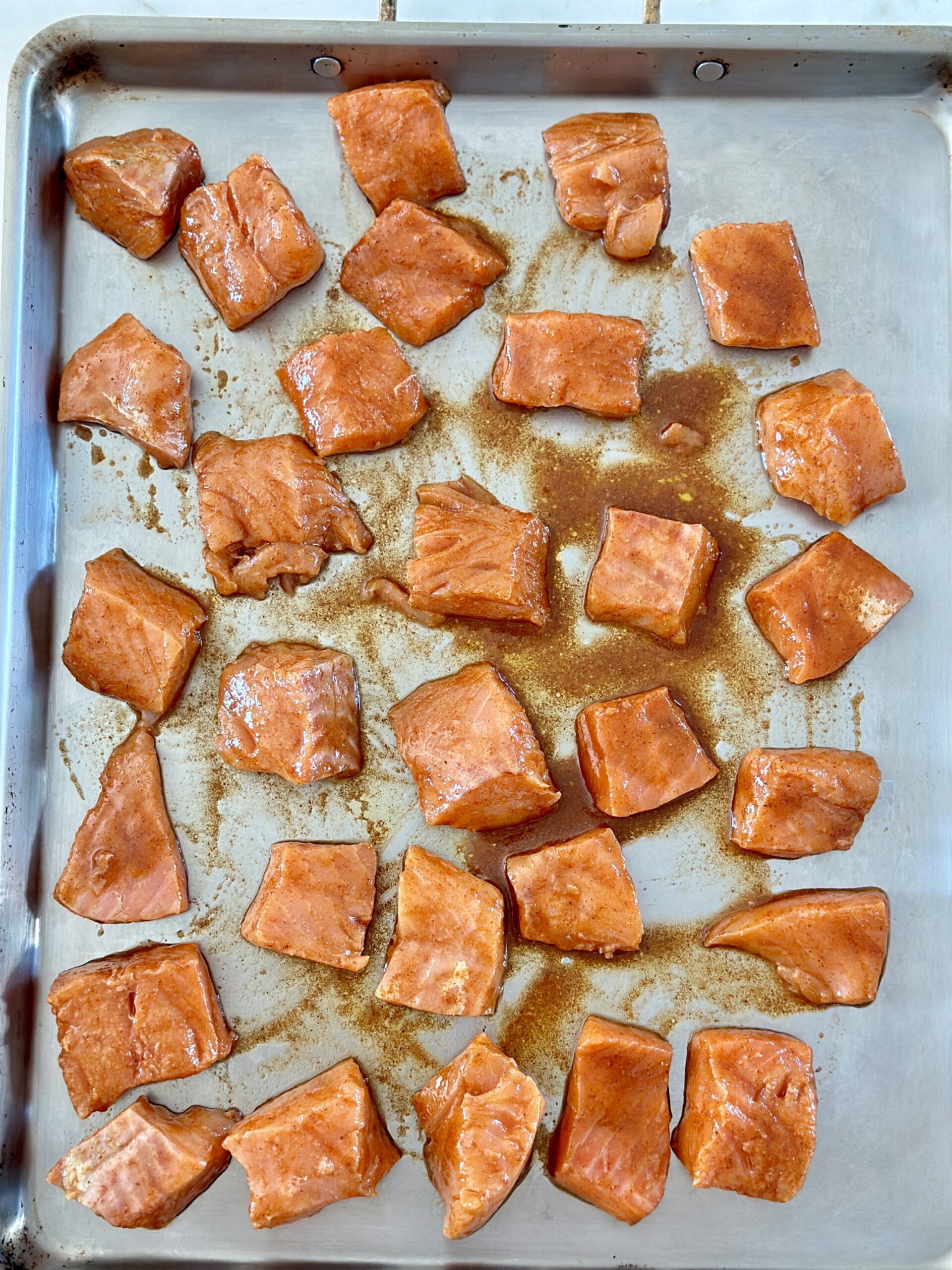 salmon on a baking sheet for oven roasted salmon 