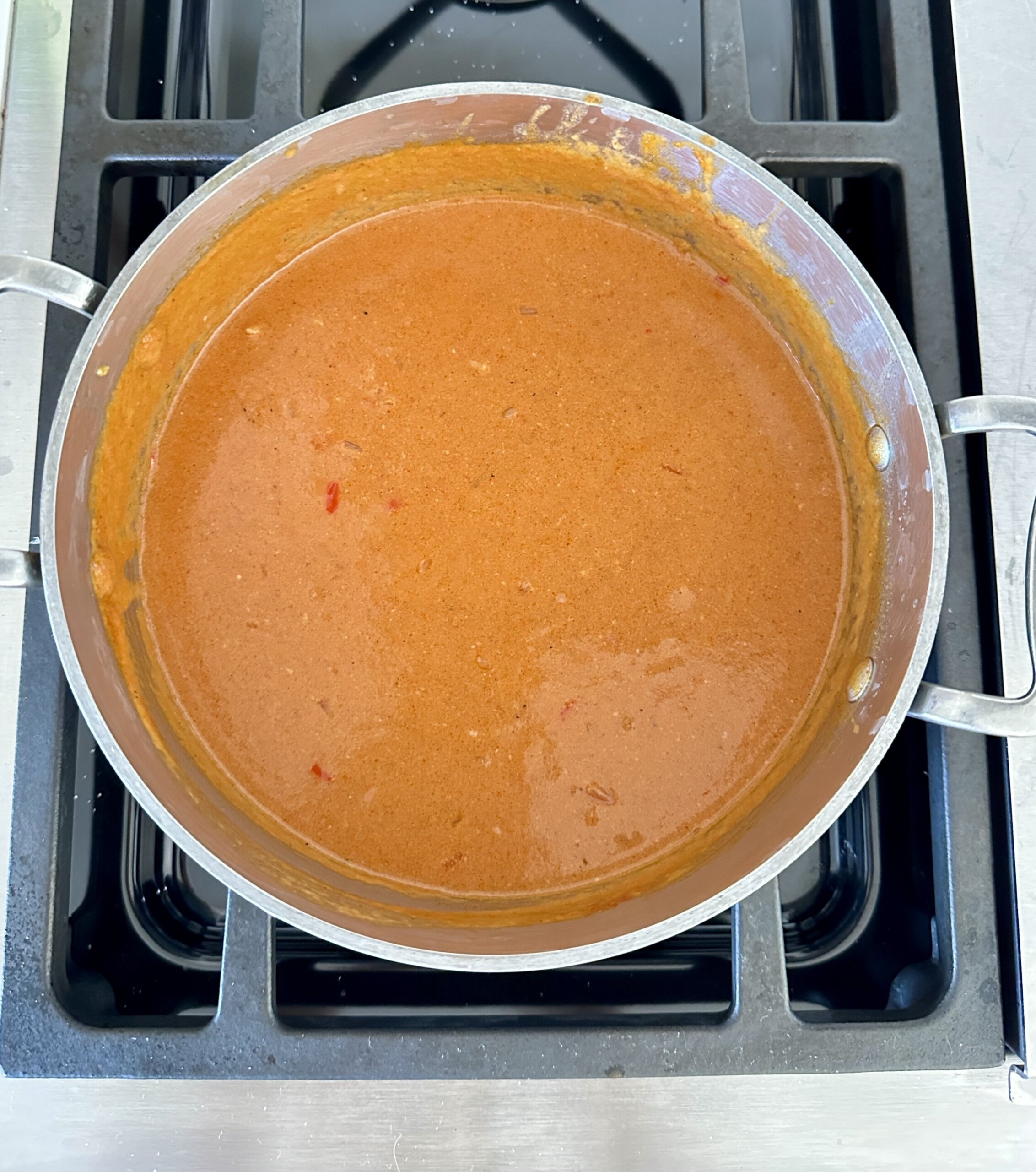 coconut tomato sauce in a saucepan