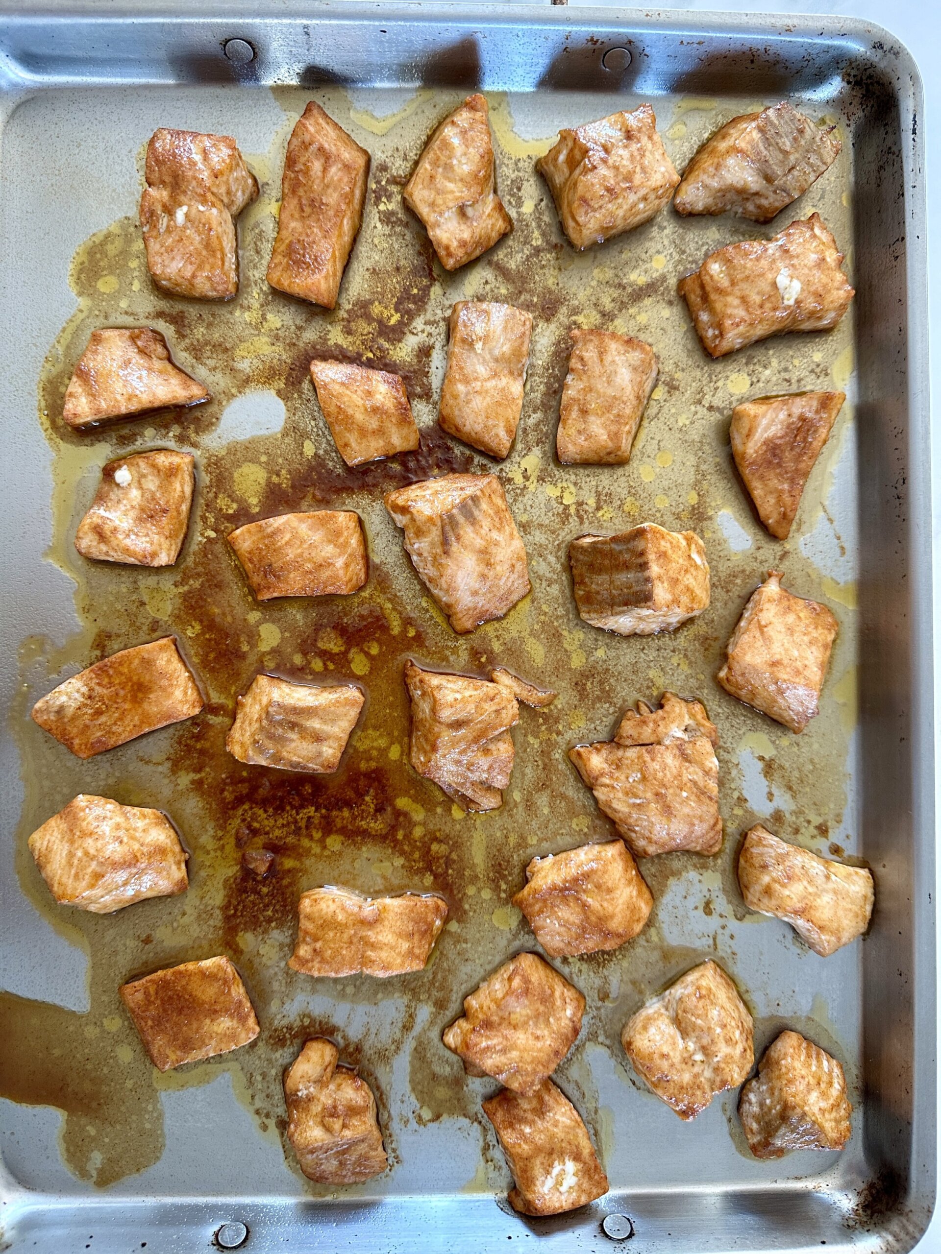 cooked salmon on a baking sheet