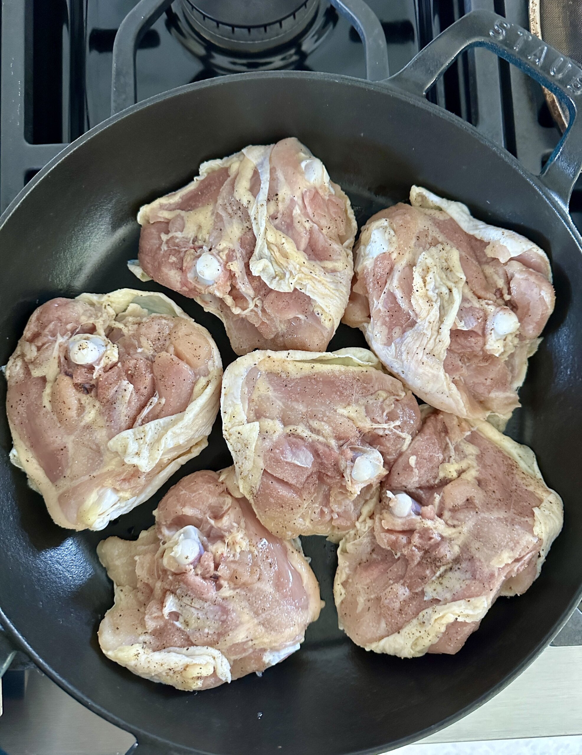 chicken thighs in a cast iron skillet