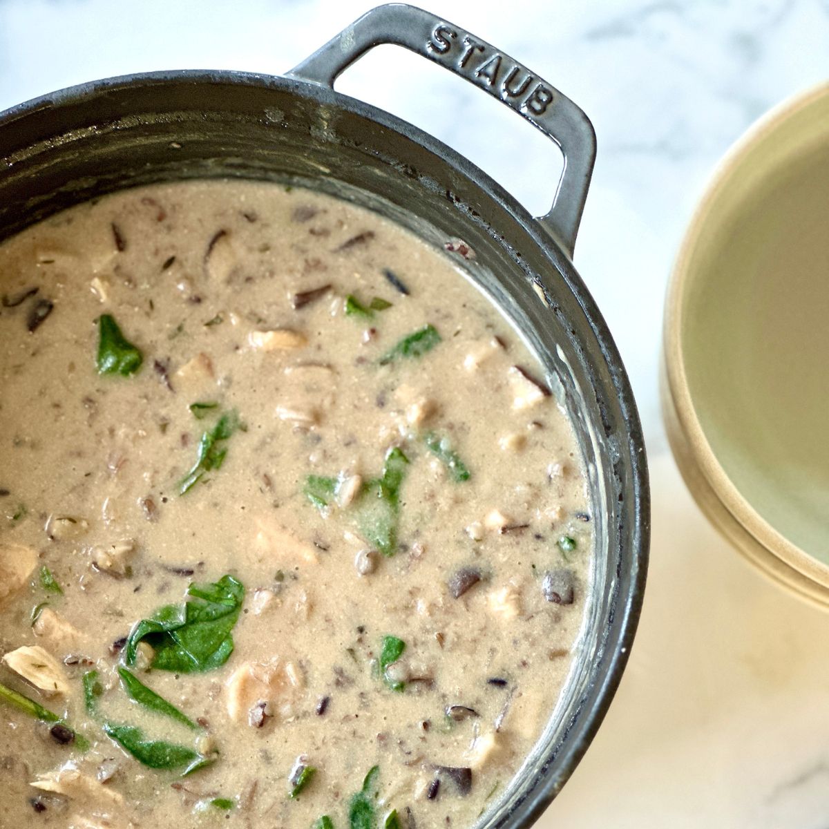 creamy chicken and wild rice soup in a large pot.