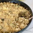 scooping a serving of this zucchini rice bake recipe