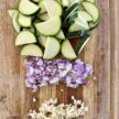 cut veggies on a wooden cutting board