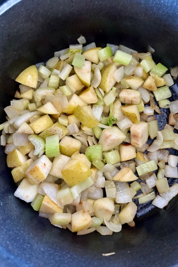 veggies sauteeing in a large skillet