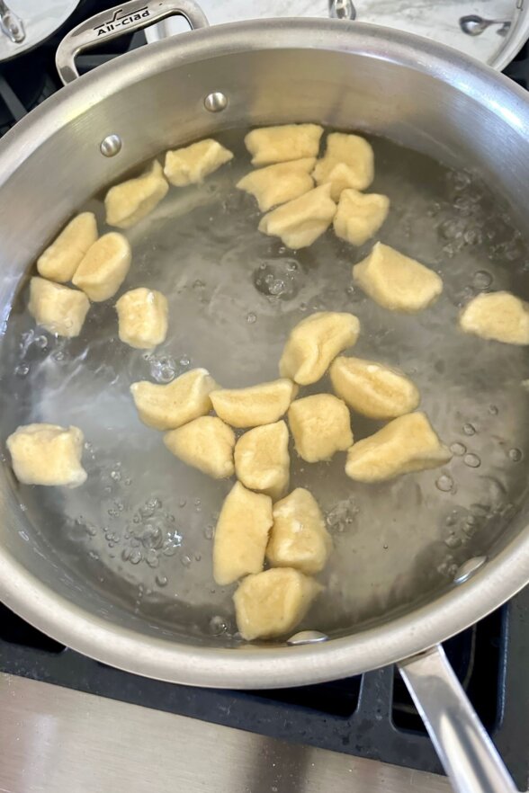 tiny mashed potato dumplings in boiling water