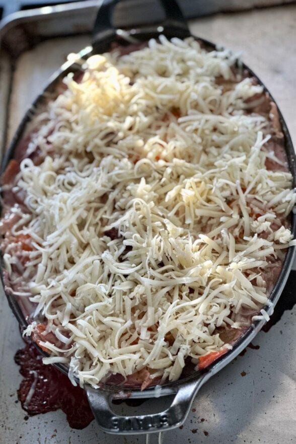 shredded cheese placed on the top of the gratin