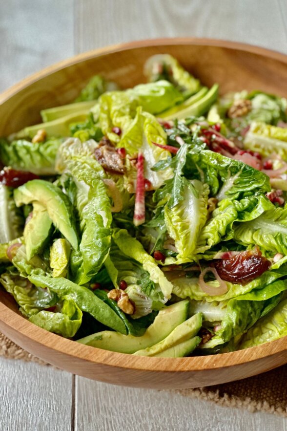 salad greens in a mixing bowl 