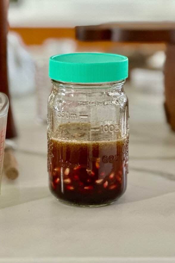 pomegranate vinaigrette ingredients in a jar with a lid