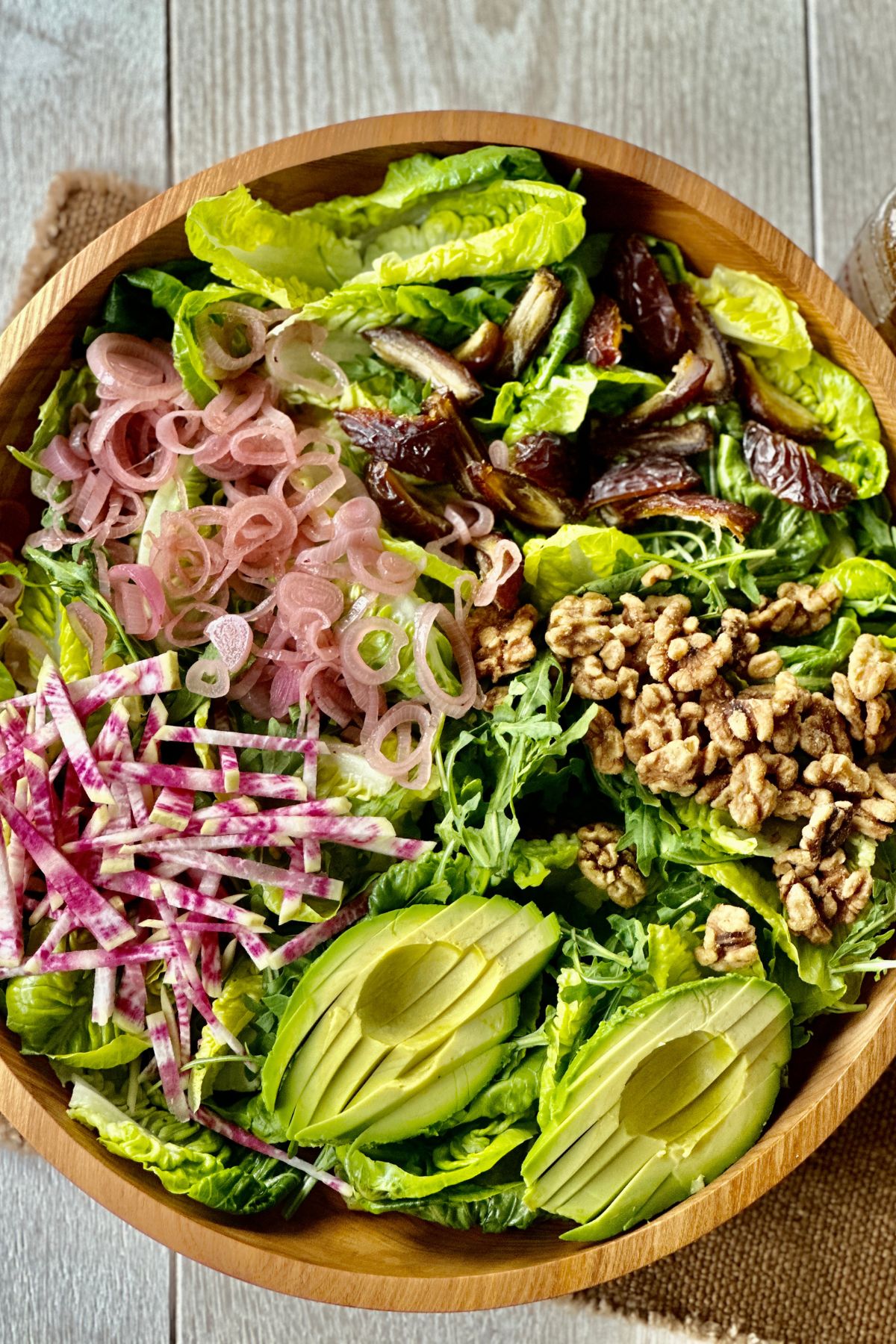 a beautiful green salad tossed with pomegranate dressing