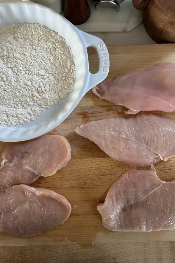 raw chicken on a cutting board